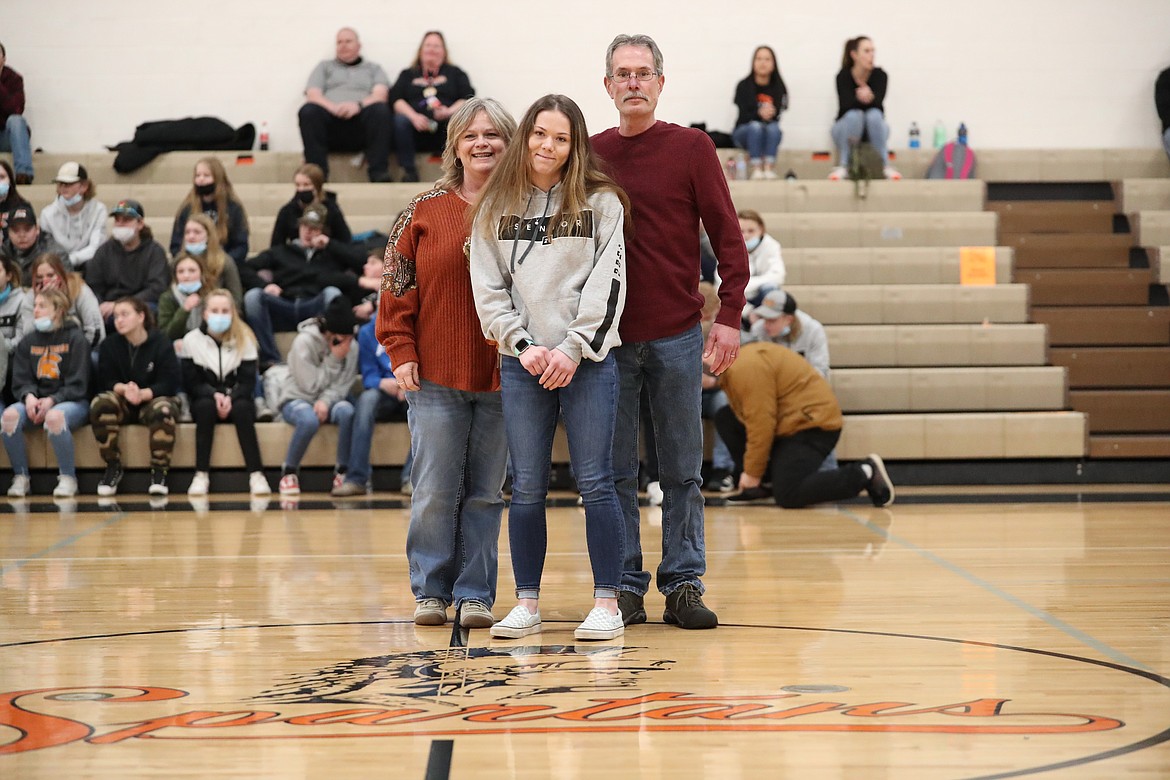 Hannah Palfrey poses for a photo with her family on Senior Night.