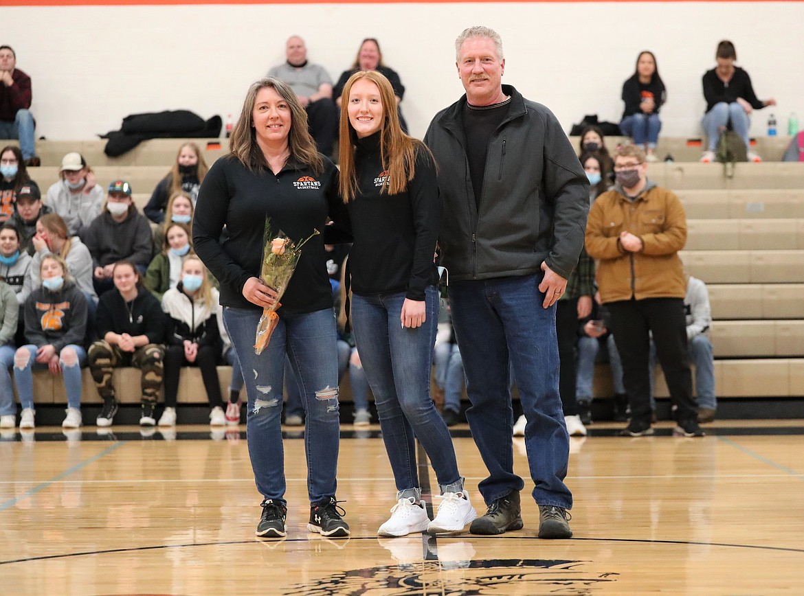 Makia Fitzmorris poses for a photo with her family on Senior Night.