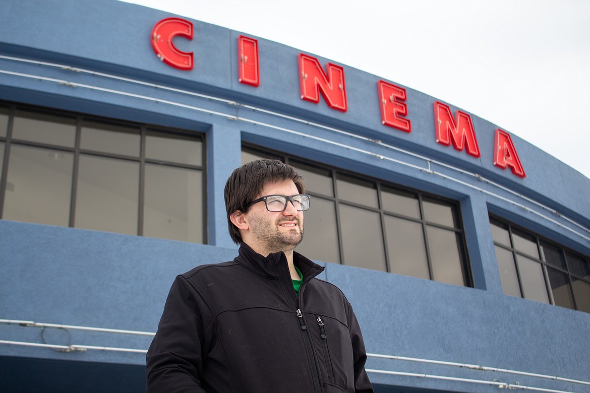 Fairchild Cinema in Moses Lake manager Andrew Jenson looks out toward the snow-filled parking lot in front of the theater on North Block Street in Moses Lake on Wednesday afternoon.