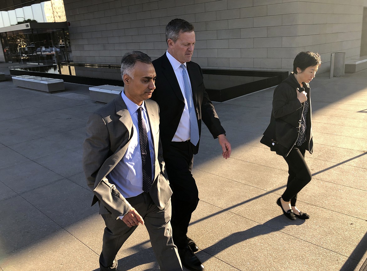 In this Friday, Nov. 22, 2019 file photo, Imaad Zuberi, left, leaves a federal courthouse with his attorney Thomas O'Brien, second from left, in Los Angeles. On Thursday, Feb. 18, 2021, Zuberi, a once high-flying political fundraiser who prosecutors say gave illegal campaign contributions to Joe Biden, Lindsey Graham and a host of other U.S. politicians while secretly working for foreign governments is set to be sentenced.
