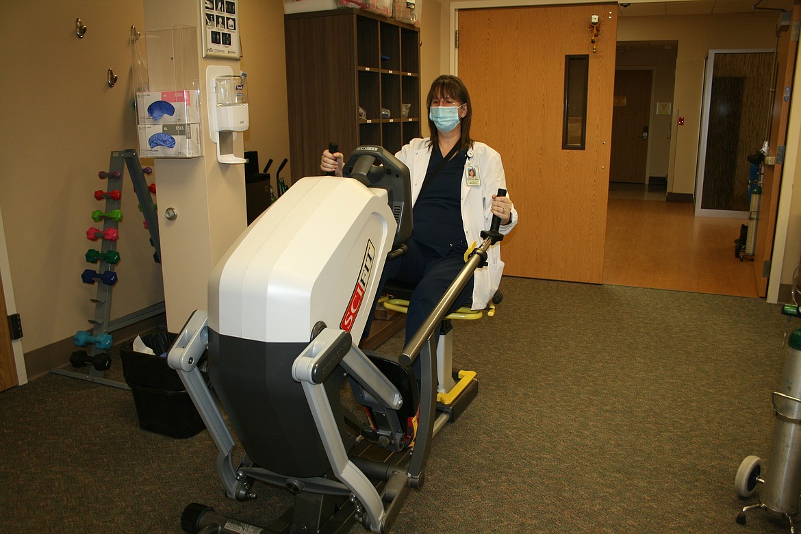 Kristina Hart works out on an exercise machine in the cardiac rehabilitation facility at Samaritan Hospital.