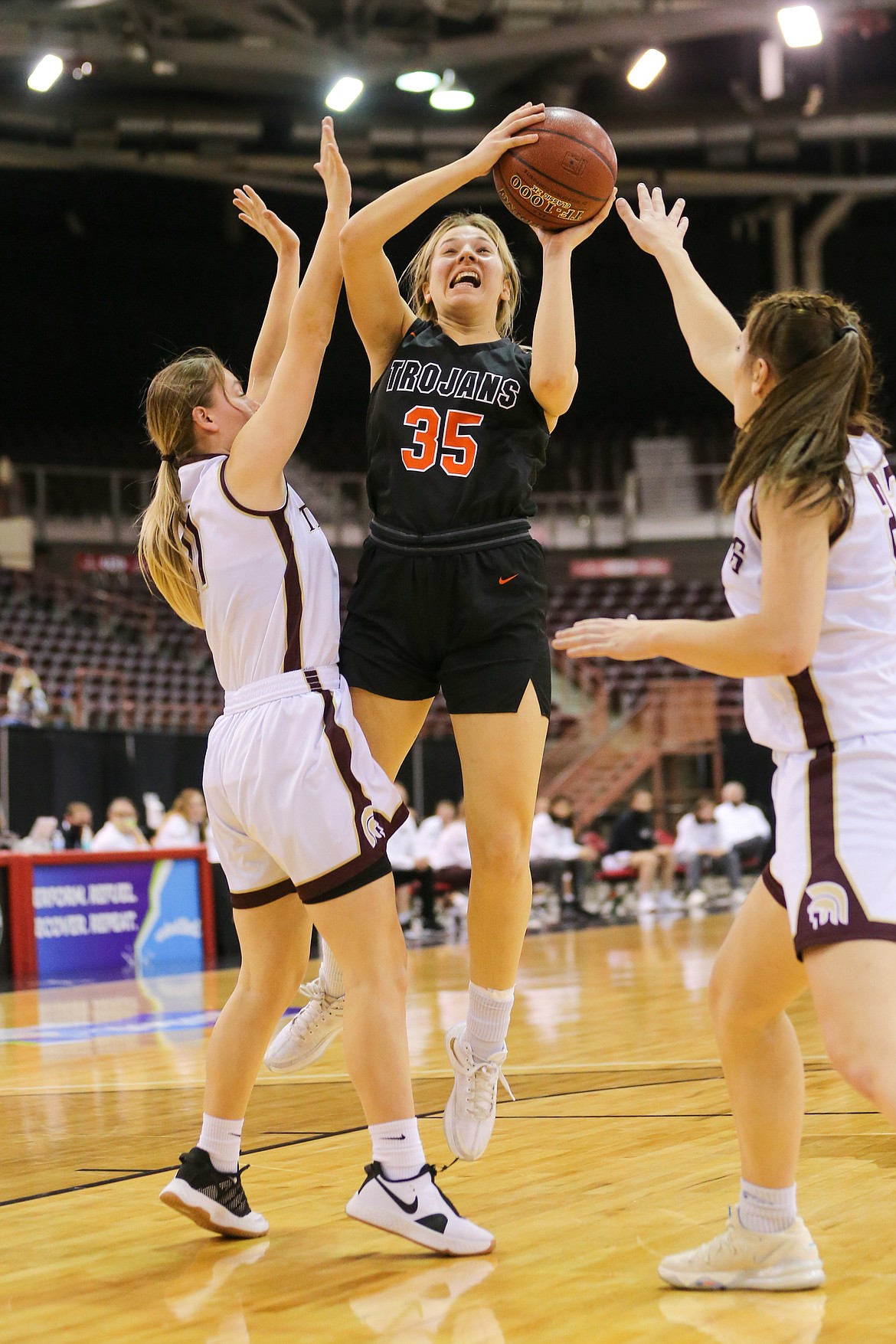 JASON DUCHOW PHOTOGRAPHY
Maya Blake (35) of Post Falls splits a pair of Rigby defenders and shoots in the lane Thursday night in a first-round game of the state 5A girls basketball tournament at the Ford Idaho Center in Nampa.