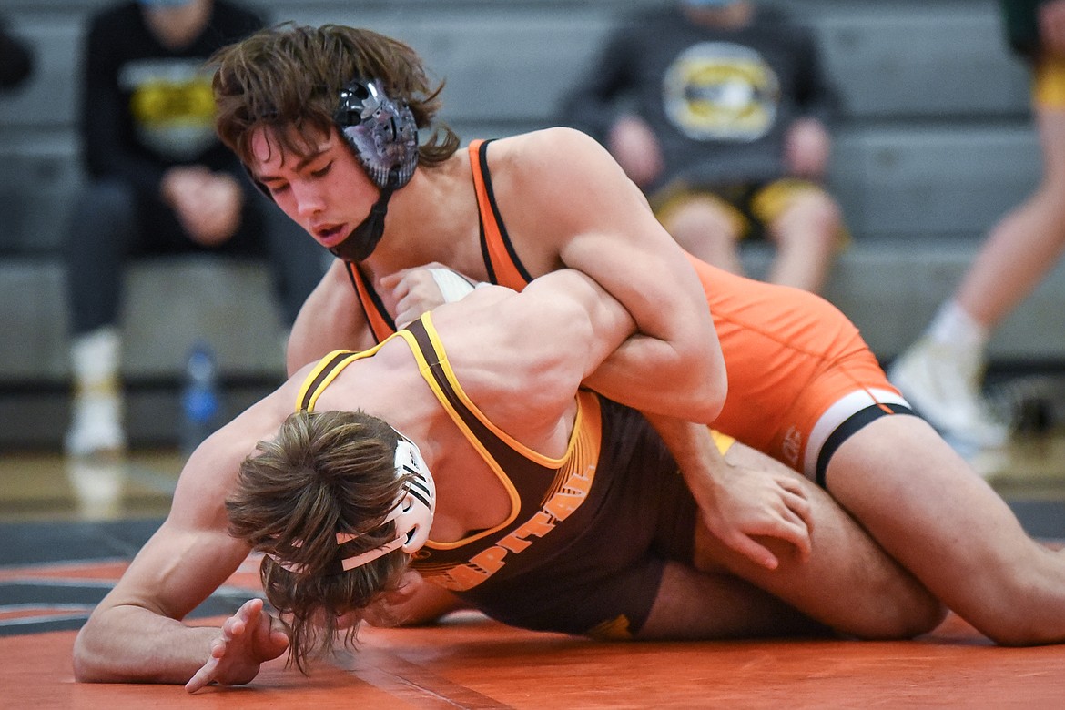 Flathead's Chase Youso wrestles Helena Capital's Dylan Graham at 170 lbs. at Flathead High School on Friday. (Casey Kreider/Daily Inter Lake)