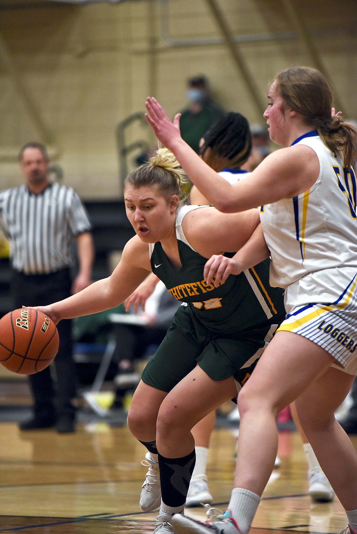 Whitefish senior Brook Smith drives into the paint during Thursday night's game against Libby. (Will Langhorne/The Western News)
