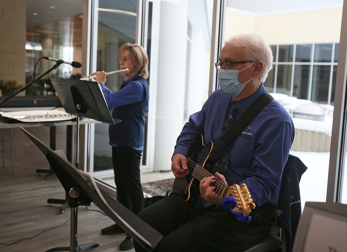 Lorena Brewer and Lane Sumner perform in the Kootenai Health cafeteria on Friday. The musicians have played every Friday since just after COVID hit and have been involved with music videos featuring Kootenai Health medical staff singing covers of songs to lift up workers in their industry.
