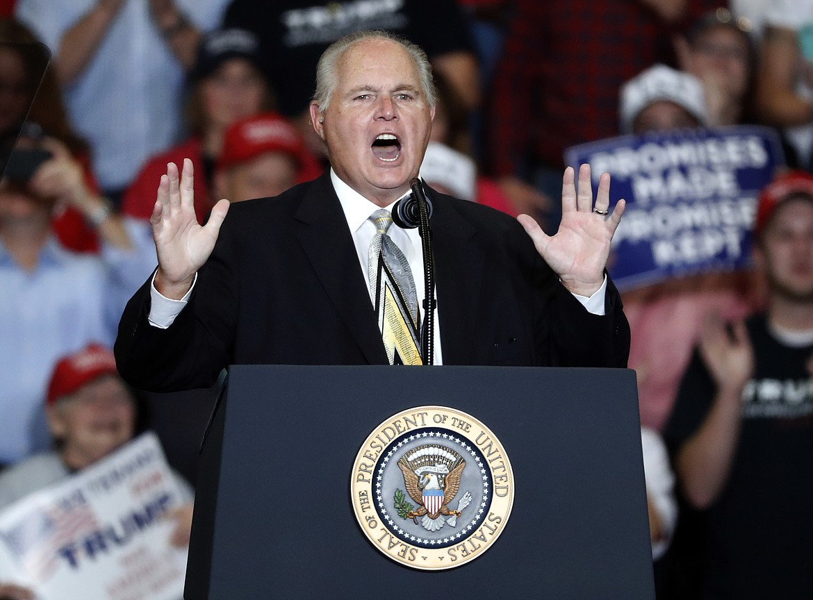 This Nov. 5, 2018, photo shows radio personality Rush Limbaugh introducing President Donald Trump at the start of a campaign rally in Cape Girardeau, Mo. Limbaugh, the talk radio host who became the voice of American conservatism, has died. (AP Photo/Jeff Roberson, File)