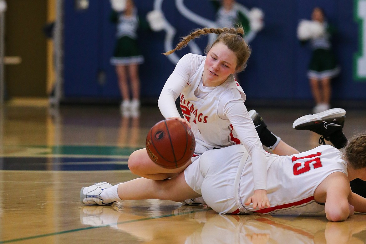 Kaylee Banks scrambles for a loose ball on Saturday.