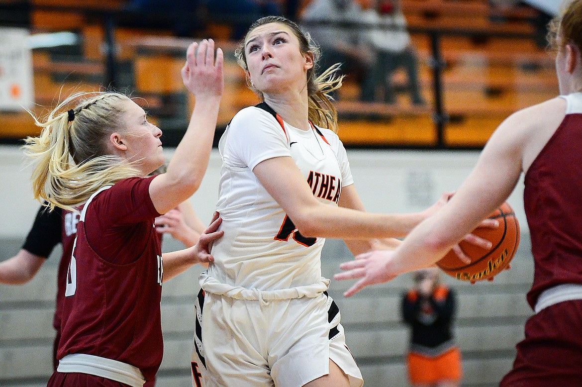 Flathead's Clare Converse (15) drives to the hoop against Helena High at Flathead High School on Saturday. (Casey Kreider/Daily Inter Lake)