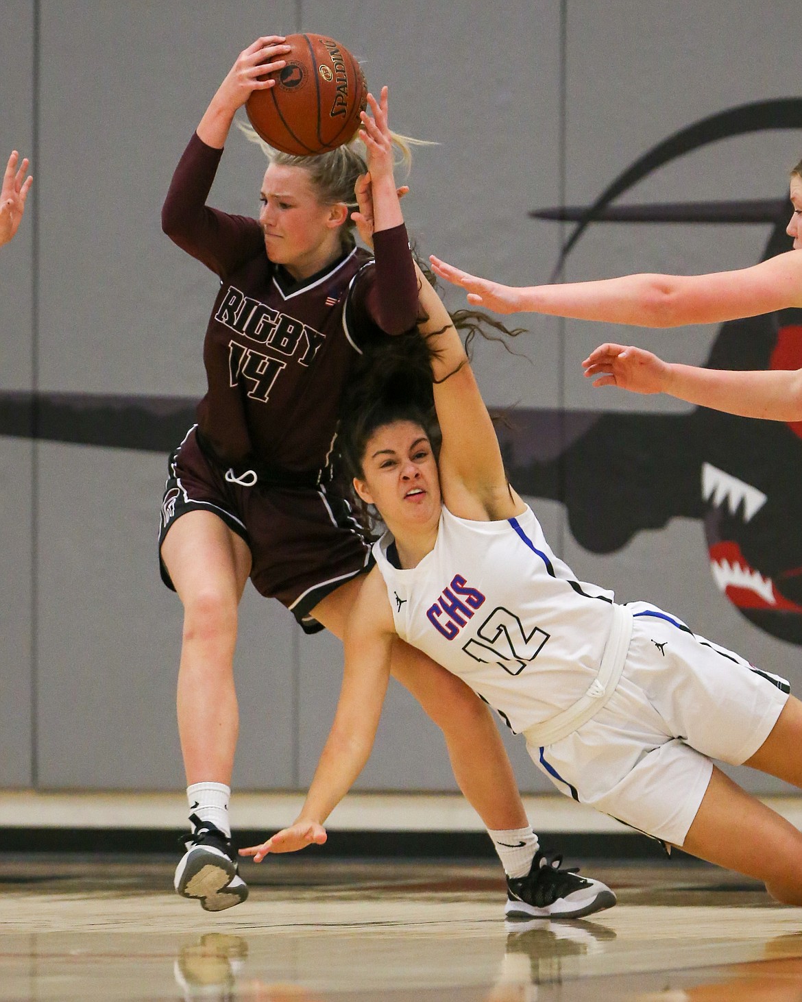 JASON DUCHOW PHOTOGRAPHY
Jayda Johnson (12) of Coeur d'Alene and Kambree Barber (14) of Rigby vie for a loose ball on Saturday in the state 5A girls basketball third-place game at Ridgevue High in Nampa.