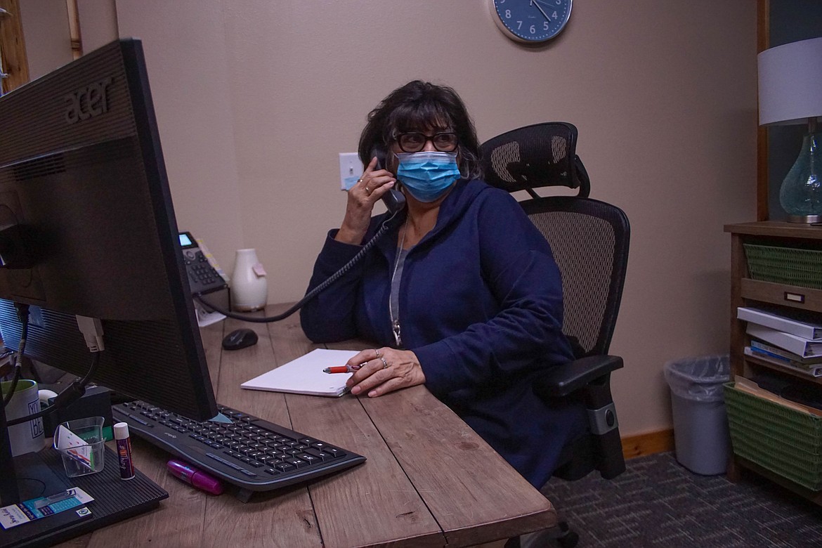 Vicki Gamboa answers the phone at Kids Hope in Moses Lake on Thursday.