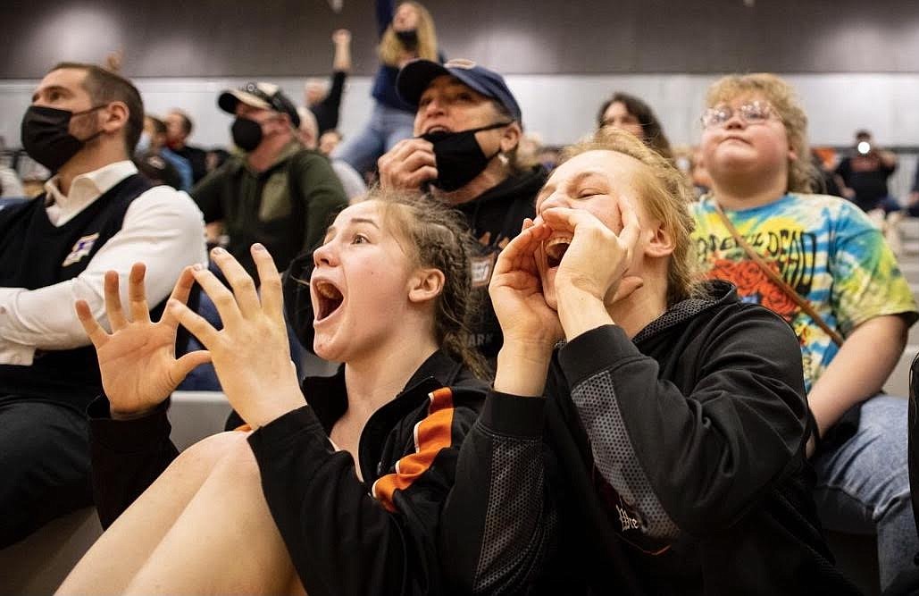 Plains-Hot Springs wrestlers Lilly MacDonald and Taylor Angle cheer on a good friend at last weekend's state tournament in Billings. (Photo courtesy Shane Angle)