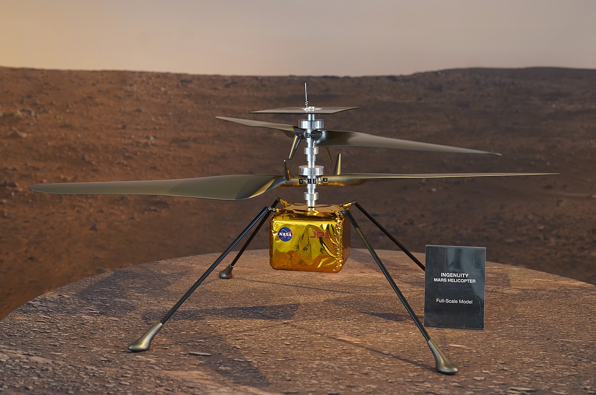 A model of the Mars Helicopter Ingenuity is displayed for the media at NASA’s Jet Propulsion Laboratory Wednesday in Pasadena, California.