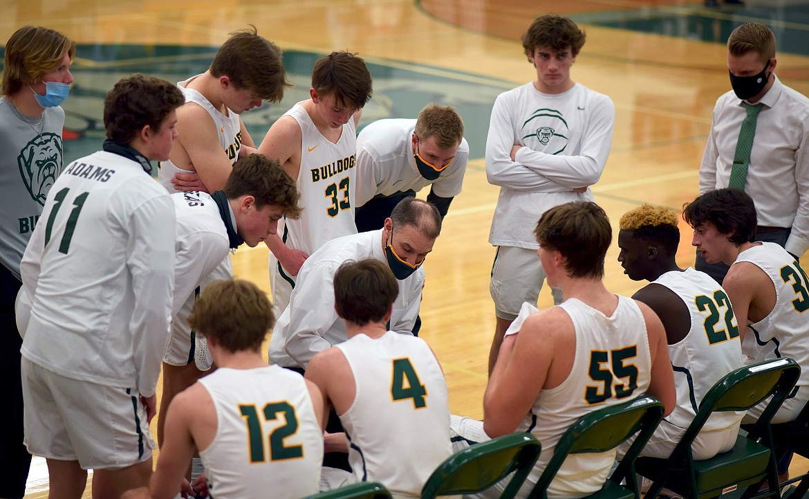 Whitefish head coach Scott Smith talks to his team during the fourth quarter of a divisional play-in game against Columbia Falls Monday night. (Whitney England/Whitefish Pilot)