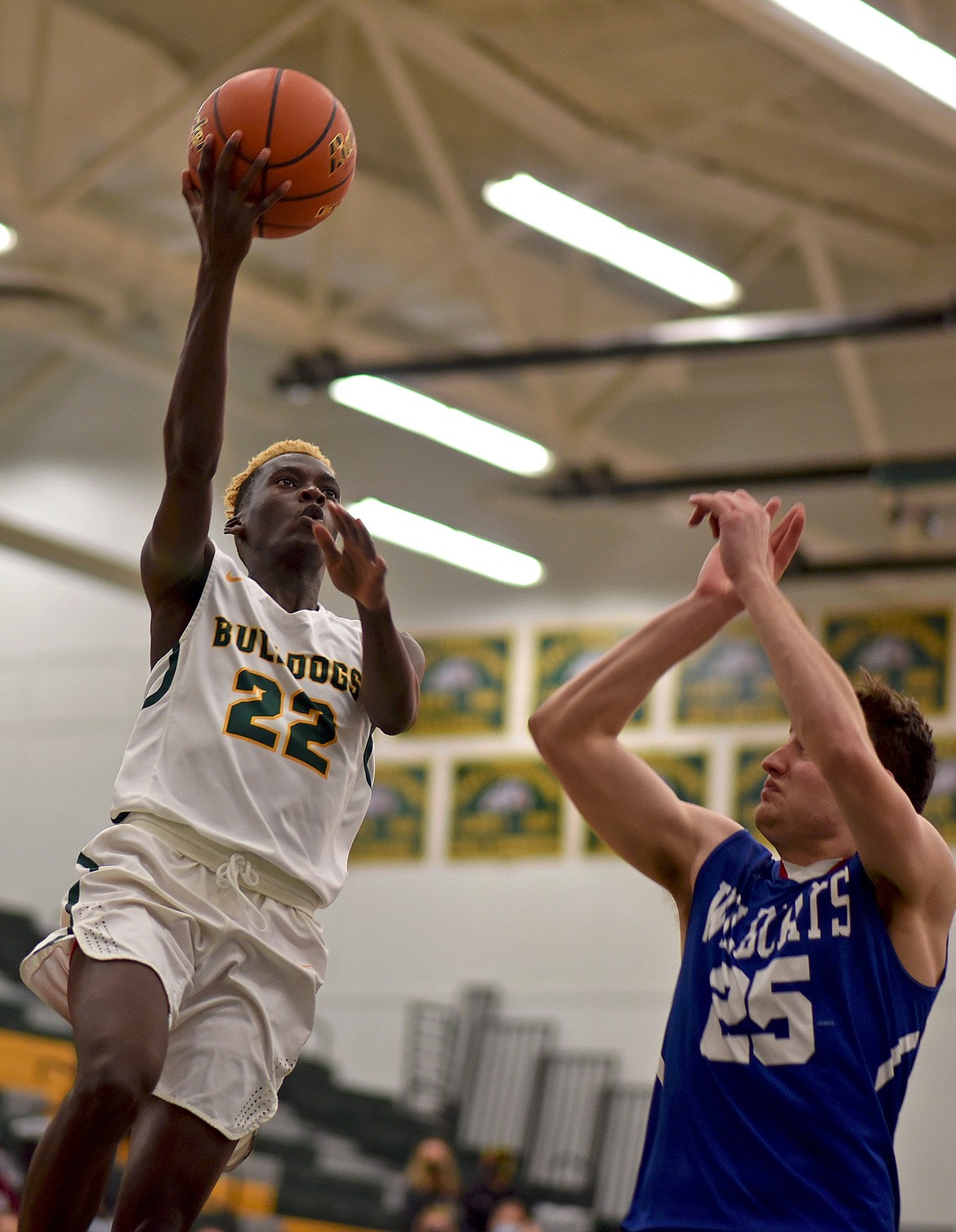 Bulldog Marvin Kimera out on the fastbreak against Columbia Falls in a divisional play-in game Monday night. (Whitney England/Whitefish Pilot)