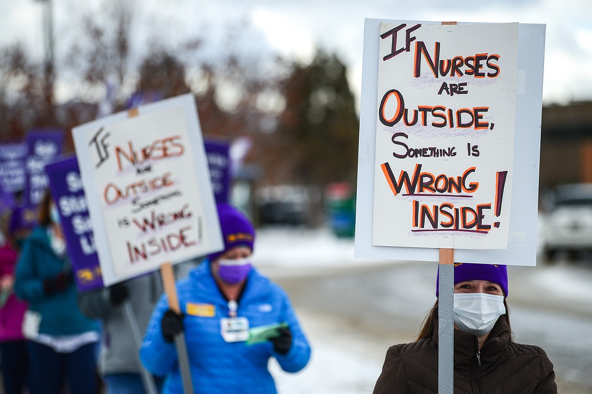 Registered nurses and healthcare workers with Logan Health/Kalispell Regional Healthcare picket outside Kalispell Regional Medical Center on Tuesday. (Casey Kreider/Daily Inter Lake)