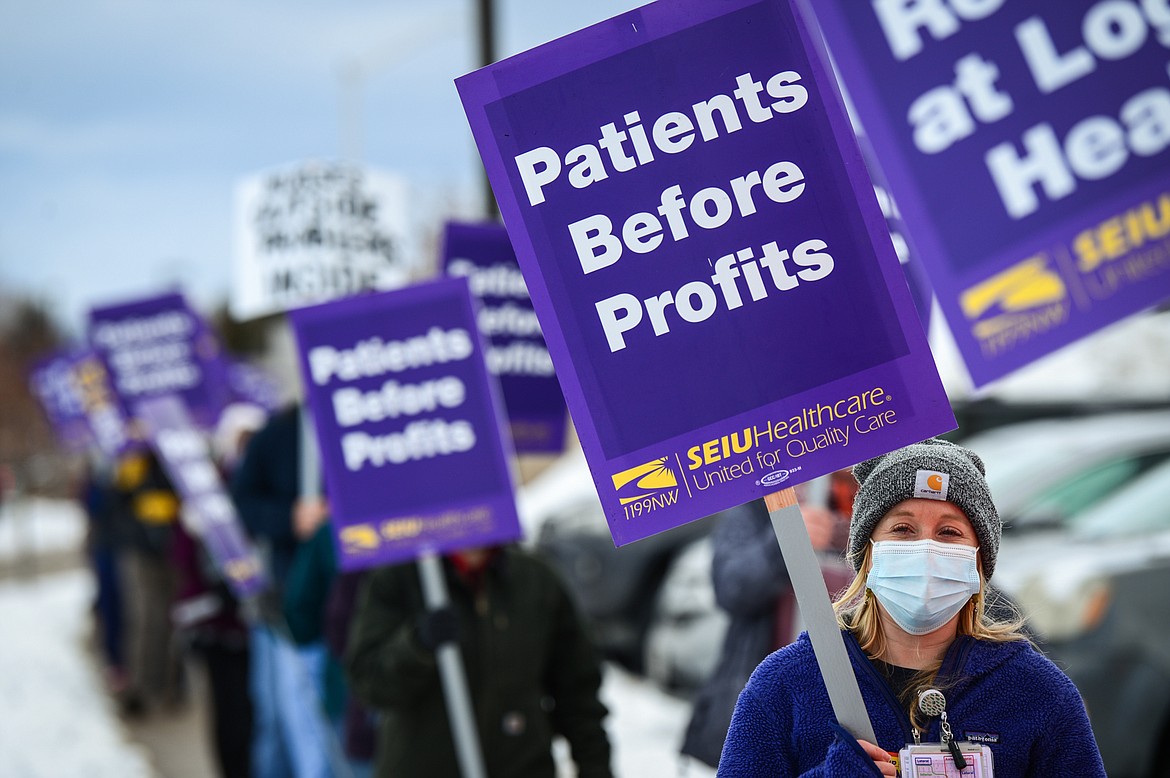 Registered nurses and healthcare workers with Logan Health/Kalispell Regional Healthcare picket outside Kalispell Regional Medical Center on Tuesday. (Casey Kreider/Daily Inter Lake)