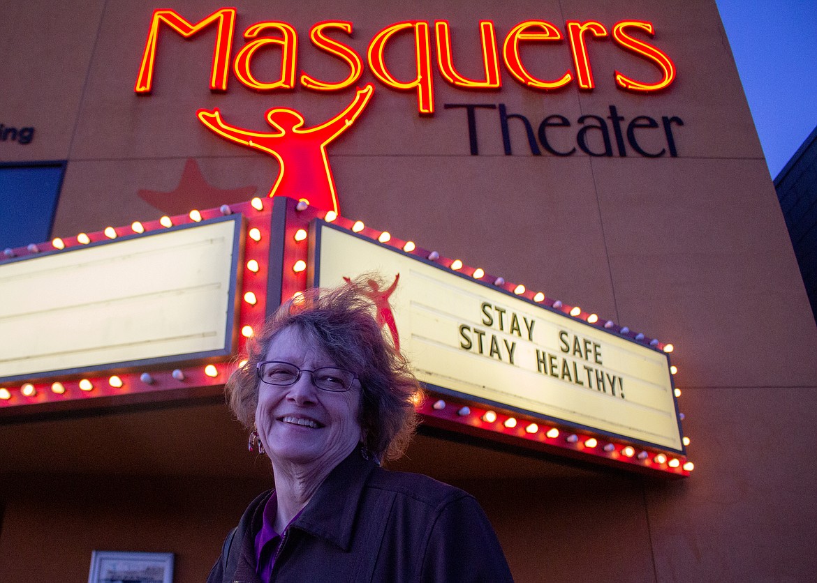 Cheri Barbre, artistic director for Masquers Theater, stands outside the theater building on East Main Avenue in Soap Lake on Monday evening.