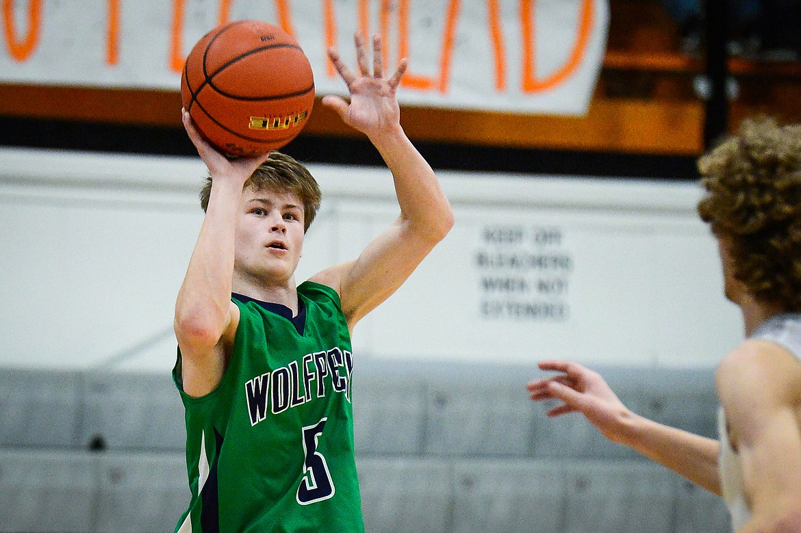 Glacier's Connor Sullivan (5) spots up for a three-pointer against Flathead at Flathead High School on Tuesday. (Casey Kreider/Daily Inter Lake)