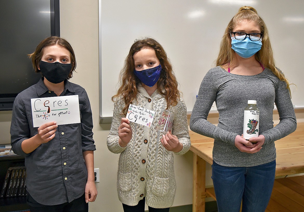 The winning team, Ceres, shows off their dressing and marketing designs after being announced the champions of the Salad Dressing Tournament at the CSE. From left to right, Cael O'Brian, Alina Pohlman, Jaclyn Tucker. (Whitney England/Whitefish Pilot)
