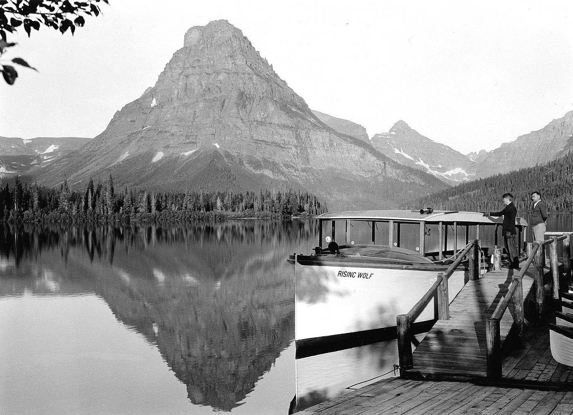 Boat Dock at Two Medicine Lake with Sinopah Mountain reflected in the Lake- photo by George Grant, July 16, 1932 (credit- NPS GLAC11343)