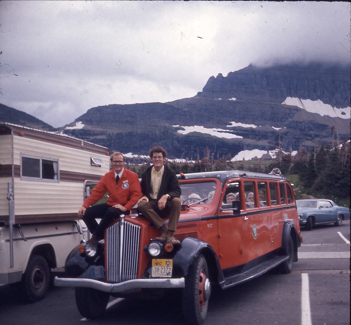 Author Mike Butler sits on his Red Bus no. 97 with his brother David Butler at Logan Pass, July 1972