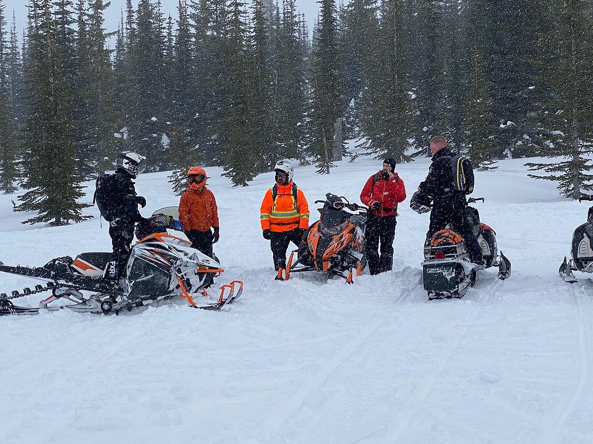 (Photo Courtesy of BCSO)

Search and Dive Rescue members with Deputies preparing for training to find a buried avalanche beacon in the Roman Nose lake area.