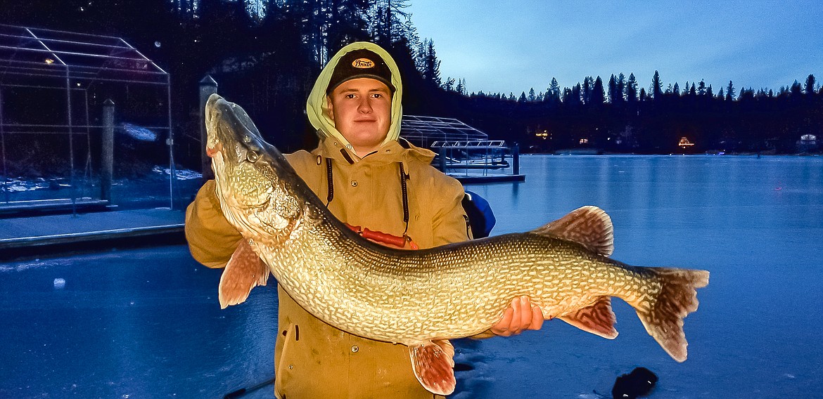 Zach Nunemacher displays the 31-pound, 46.5-inch northern pike he caught Feb. 12 in Hayden lake.