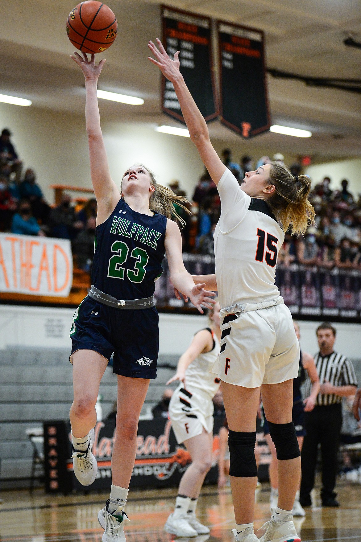 Glacier's Janessa Henson (23) shoots over Flathead's Clare Converse (15) at Flathead High School on Thursday. (Casey Kreider/Daily Inter Lake)