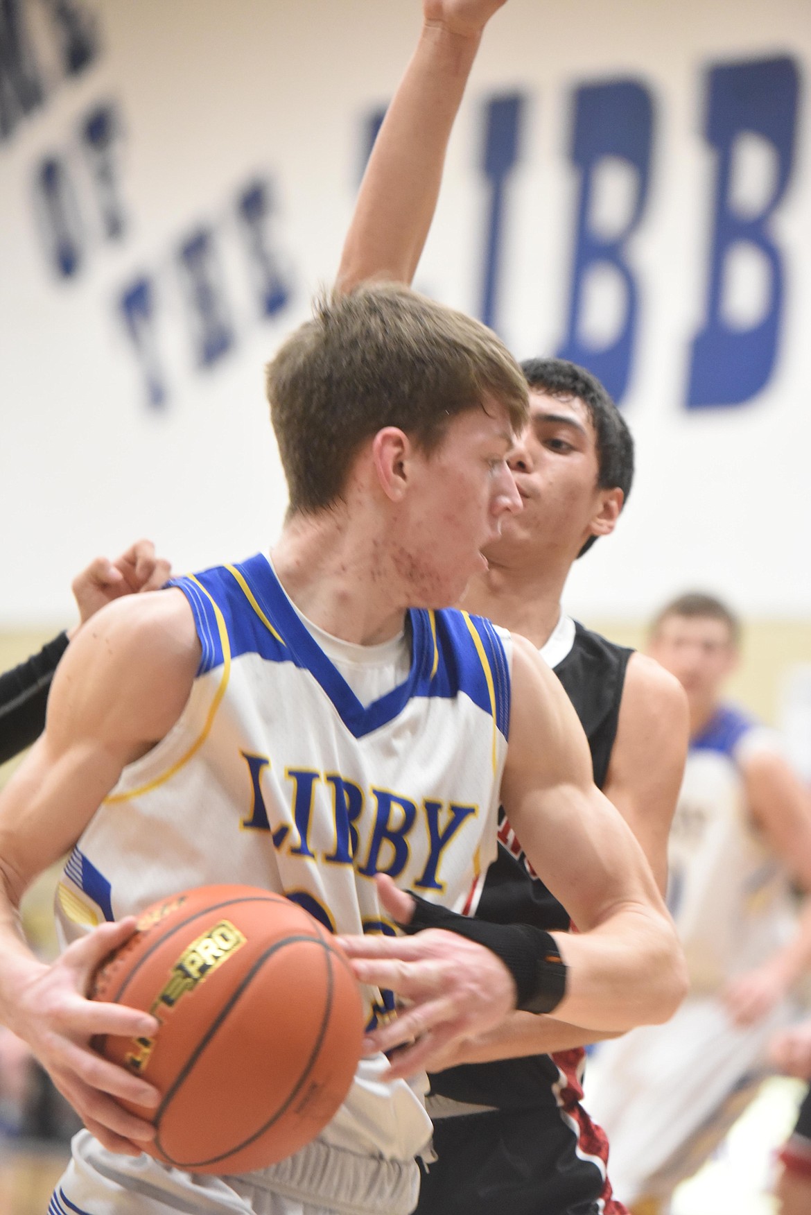 Caden Williams looks to get around a defender during the Loggers Feb. 23 game against Browning. (Will Langhorne/The Western News)