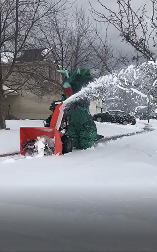 Residents of a Coeur d’Alene neighborhood spotted this triceratops clearing sidewalks with a snowblower on Thursday. Annie Williamson cleared one side of the street in an inflatable costume, then switched to another costume before tackling the other side. Photo courtesy of Anne Capellen
