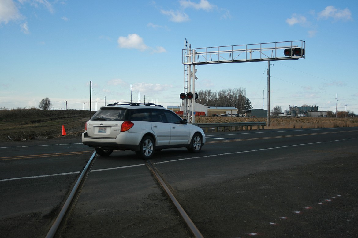 A car crosses the railroad tracks near Basic American Foods south of Moses Lake. The railroad crossing, and State Route 17, will be closed for three days beginning March 5 so construction crews can install upgrades.