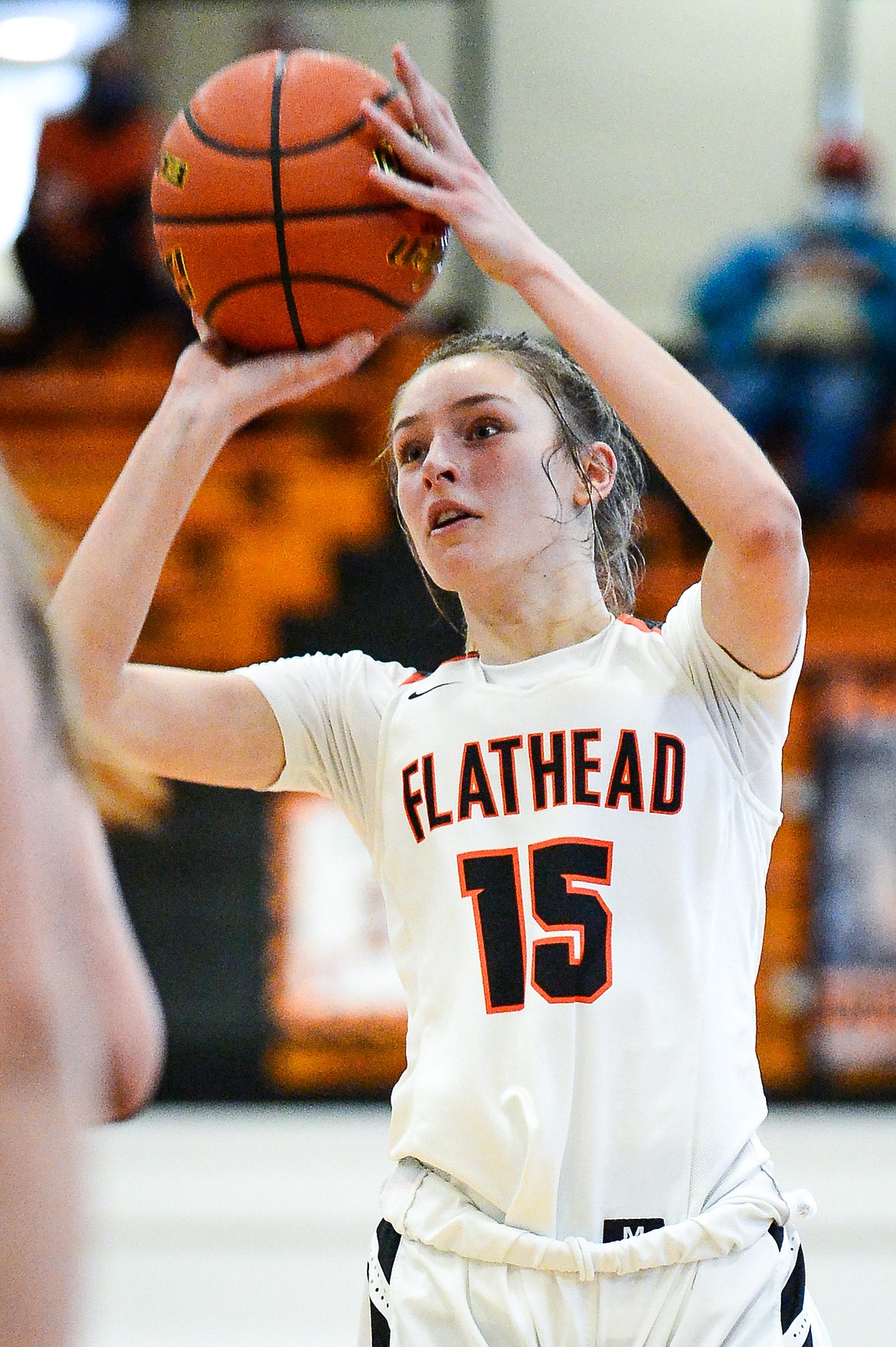 Flathead's Clare Converse (15) spots up for a three-pointer against Missoula Hellgate at Flathead High School on Saturday. (Casey Kreider/Daily Inter Lake)