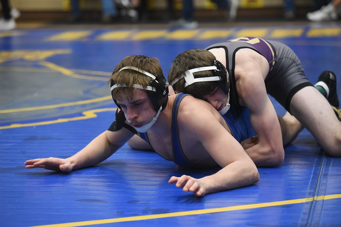 Polson’s Noah Trosper tangles with Greenchain’s Xander Spady at 138 pounds Friday at Libby. (Will Langhorne/The Western News)