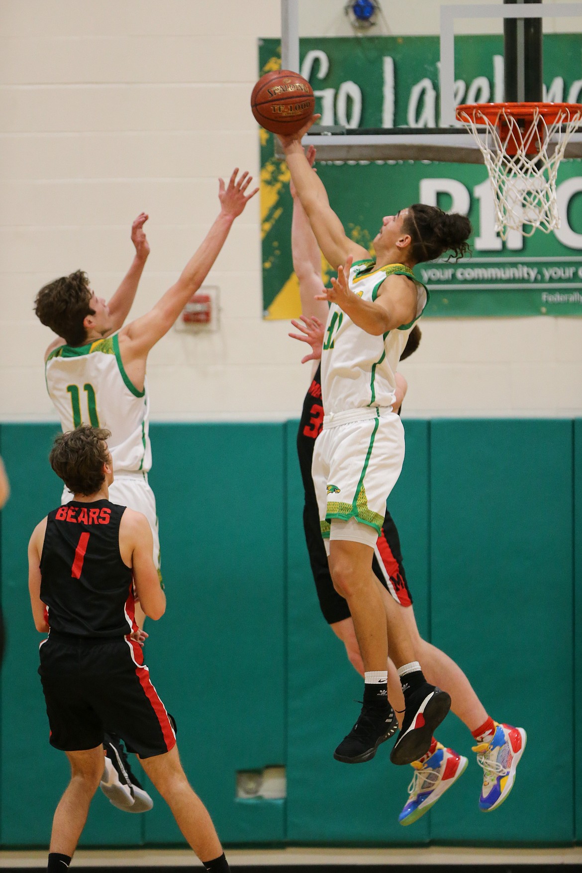 JASON DUCHOW PHOTOGRAPHY
Jalen Skalskiy (31) of Lakeland soars for one of his 13 rebounds Saturday night against Moscow in the deciding game of the 4A Region 1 boys basketball tournament at Hawk Court.