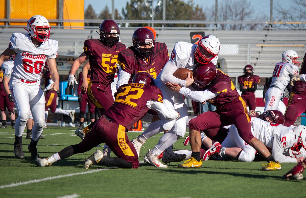 The Moses Lake defense combines to bring down the Cascade rusher in the football jamboree at Lions Field in Moses Lake on Saturday afternoon.