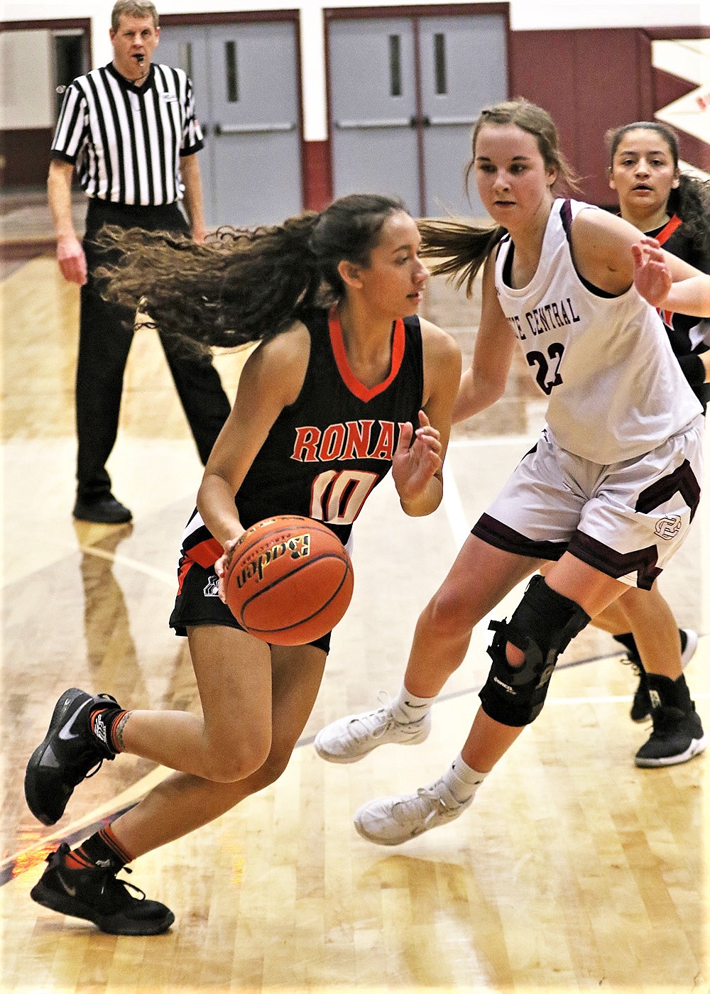 Ronan sophomore Leina Ulutoa drives the baseline against Butte Central. (Courtesy of Bob Gunderson)