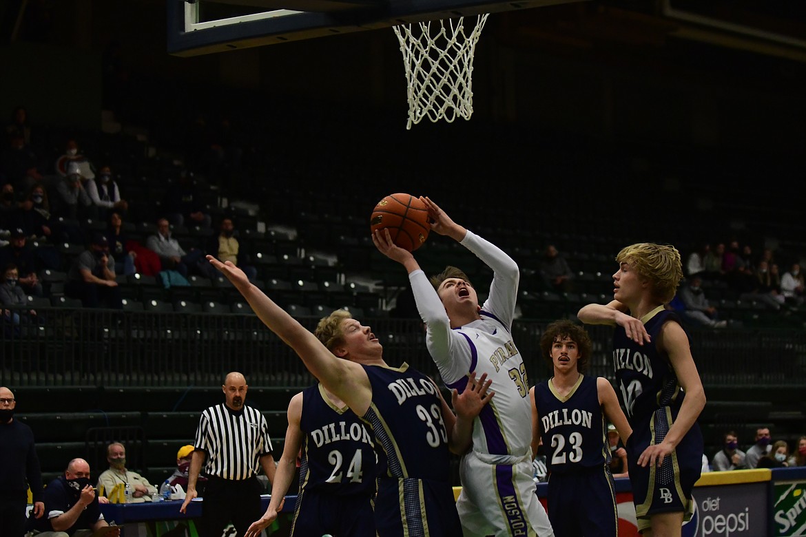 Polson's Colton Graham, surrounded by Dillon defenders, looks for two points during the title game at Butte on Saturday. (Teresa Byrd/Hungry Horse News)