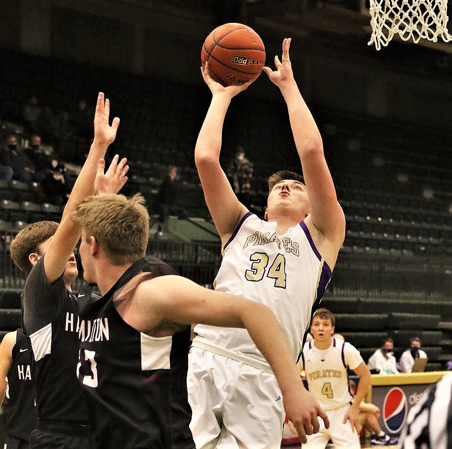 Trevor Lake puts up a shot in the paint against Hamilton on Thursday at Butte. (Courtesy of Bob Gunderson)