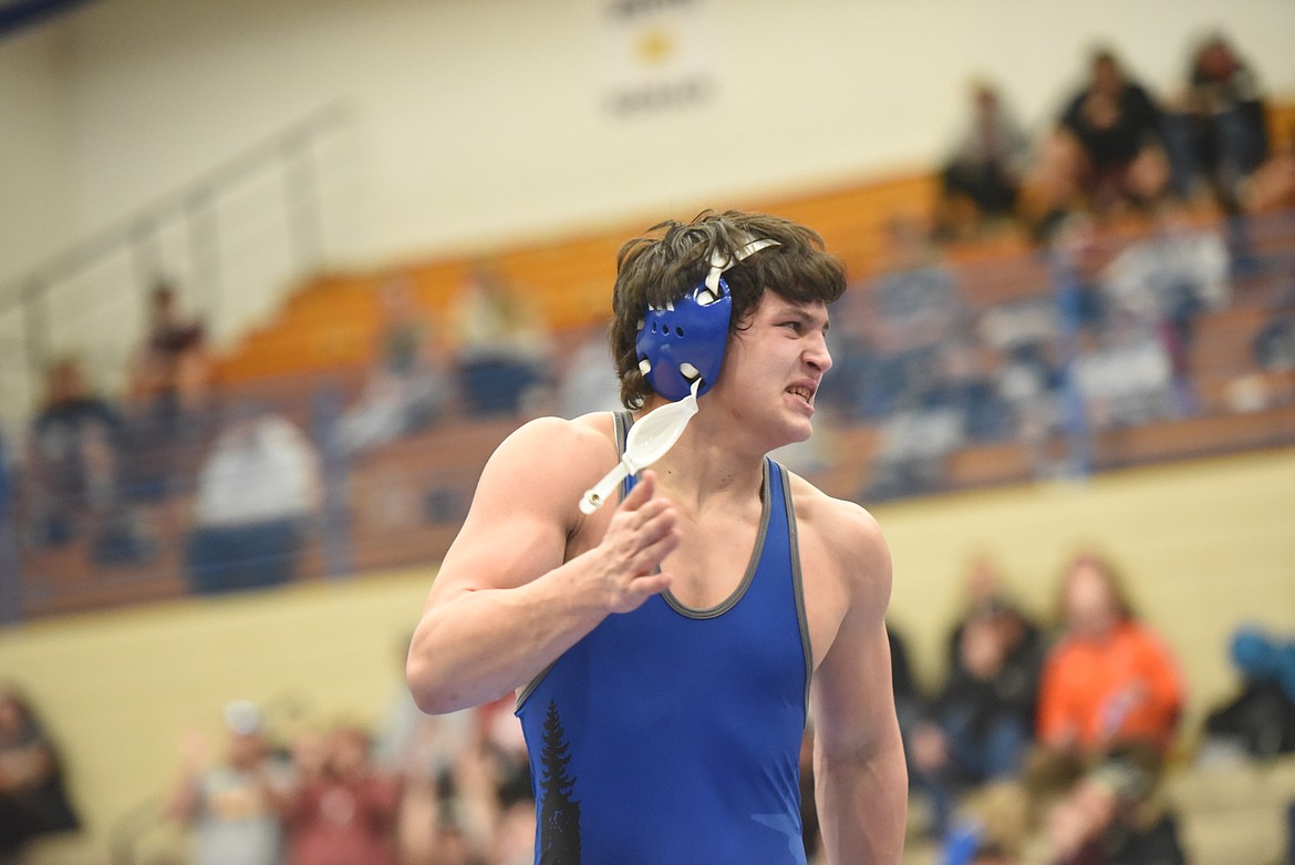 Greenchain’s Jace DeShazer celebrates after winning the semifinals of the 160-pound category against Frenchtown’s Gavin McLean Feb. 27. (Will Langhorne/The Western News)