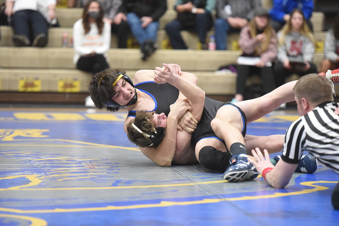 Greenchain’s Cody Crace looks to pin Ronan’s Trapper McAllister in the 152-pound championship match at the Western A Divisional tournament in Libby Feb. 27. (Will Langhorne/The Western News)