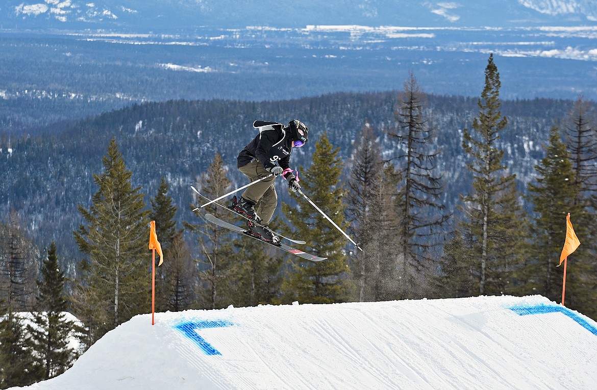 Ethan Karvelsson with the WMR Freestyle Team throws a trick on his first run down Central Park during the Presidents Park Slopestyle competition at Whitefish Mountain Resort on Feb. 14. (Whiteney England/Whitefish Pilot)