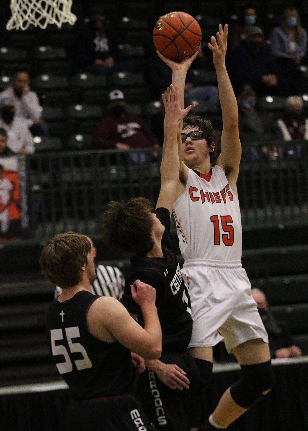 Payton Cates fires off a jumper in the tournament opener against Butte Central. (Courtesy of Bob Gunderson)