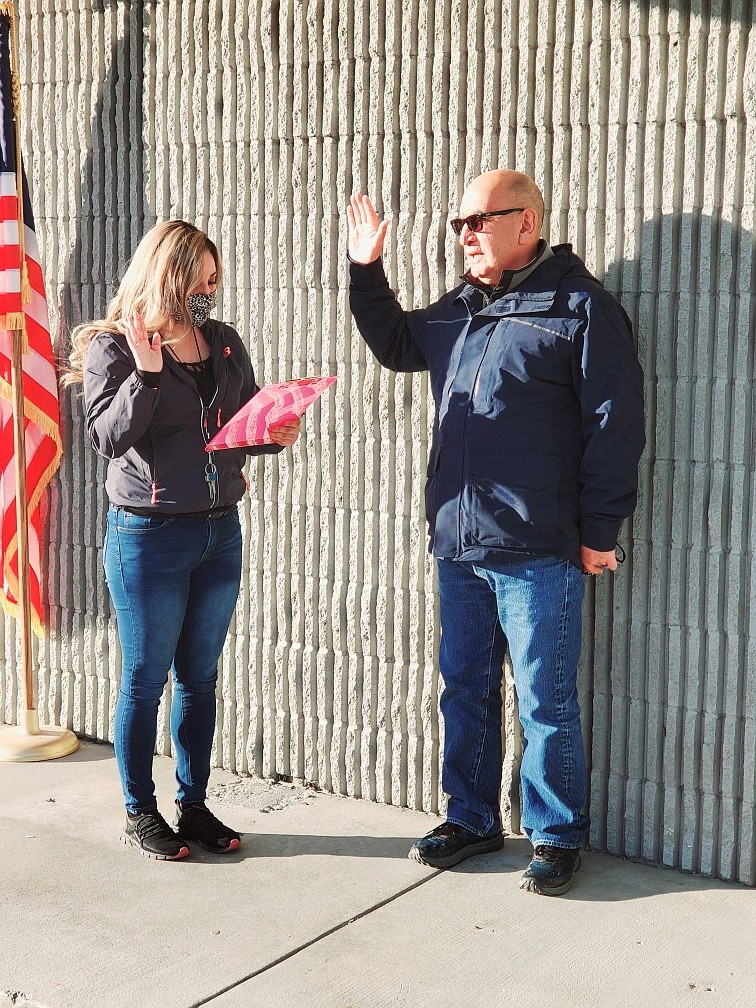 Mattawa City Clerk Anabel Martinez administers the oath of office to new Mattawa City Council member Vicente Acosta.
