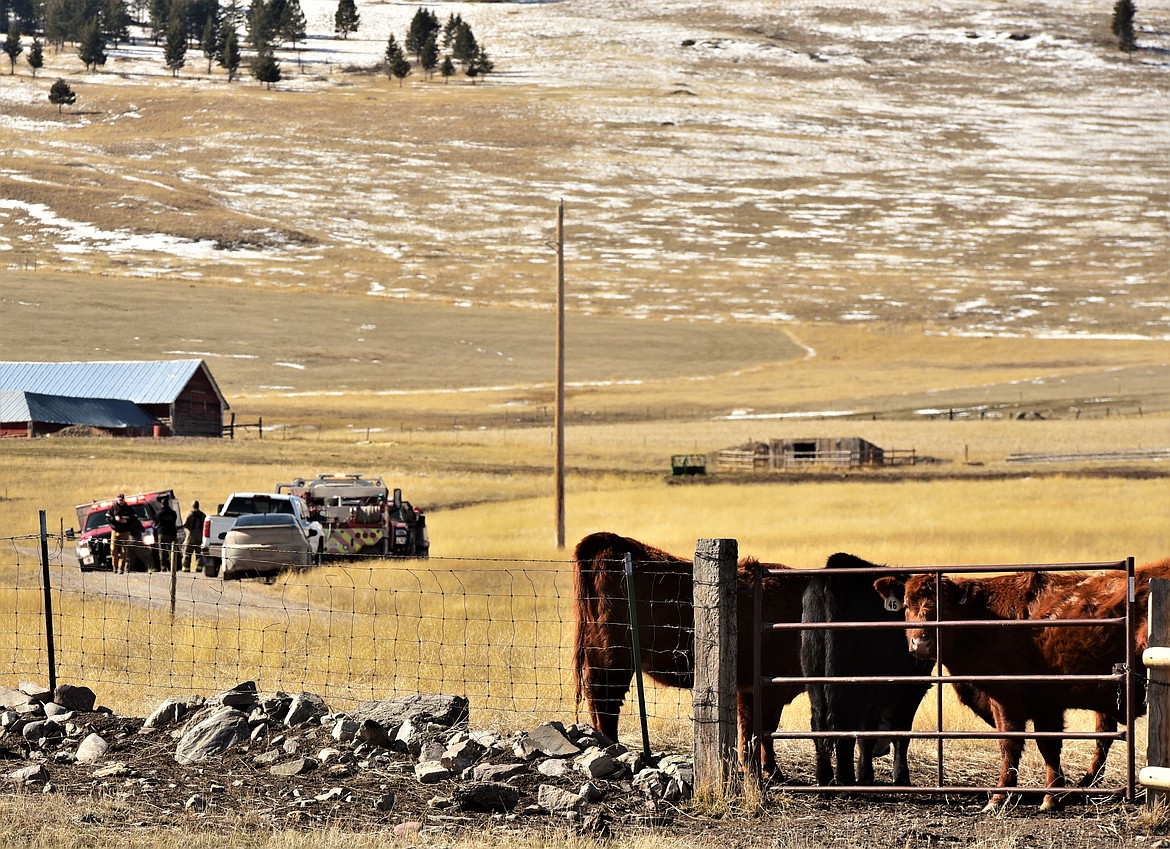 Fire and ambulance personnel set up a staging area on private ranchland just south of Irvine Flats Road on Monday. (Scot Heisel/Lake County Leader)