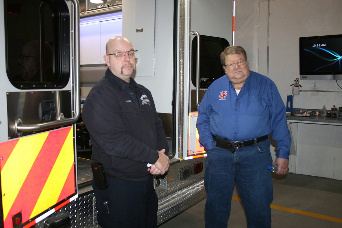 Grant County Fire District 10 chief Eric Linn (left) and commissioner Dwight Vander Vorste stand in the new Grant County Fire District 10 station.