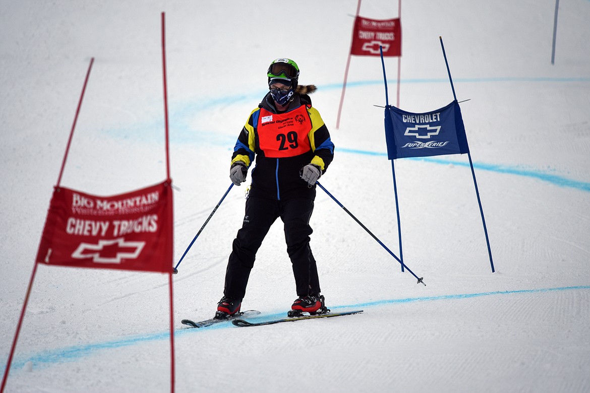 Jim Winegar, with the Flathead Industries team, weaves through the Alpine Novice Giant Slalom course at the Special Olympics Montana Winter Games at Whitefish Mountain Resort on Tuesday. (Casey Kreider/Daily Inter Lake)