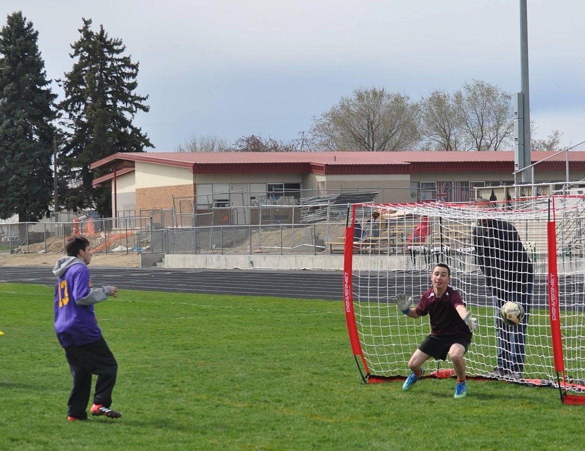 Right, Moses Lake High School's Isaac Thurman goes to block the shot in goal for the Chiefs during a unified soccer match in 2018.