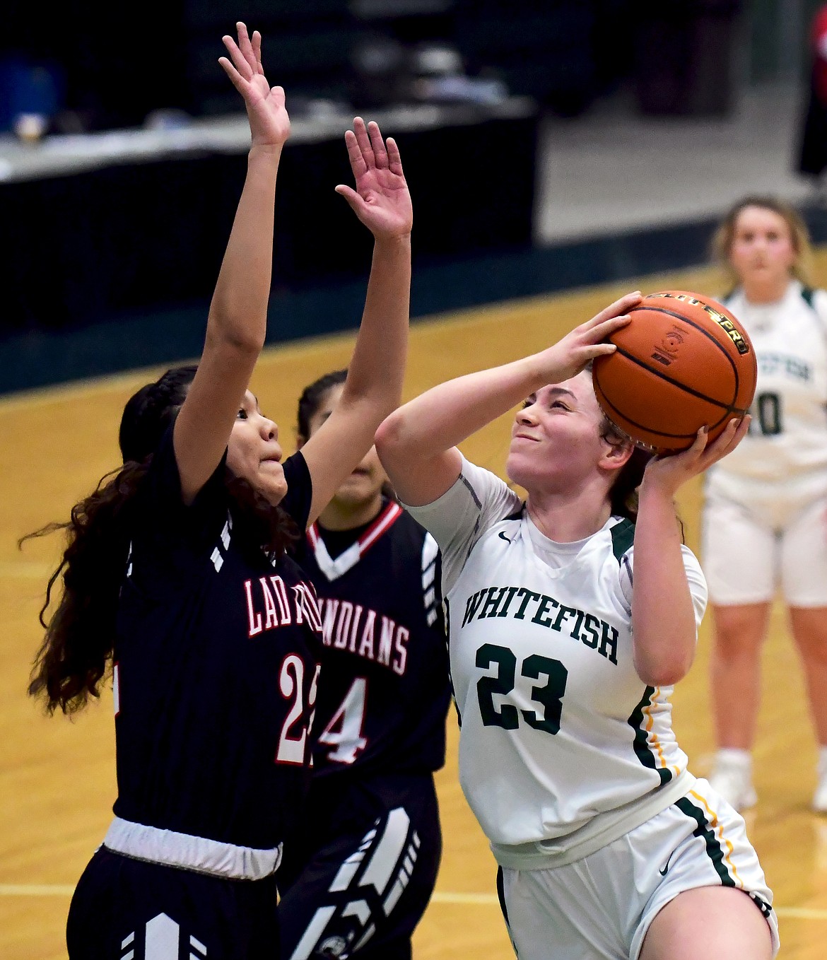Whitefish's Gracie Smyley drives to the hoop against Browning during the Western A Divisional Tournament on Saturday in Butte. (Teresa Byrd/Hungry Horse News)