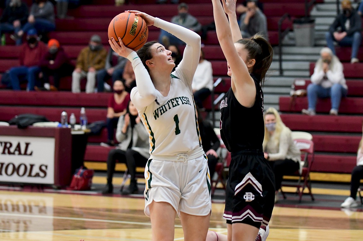 Whitefish junior Jadi Walburn tries to shoot over the Butte Central defense during the Western A Divisional Tournament on Friday in Butte. (Teresa Byrd/Hungry Horse News)