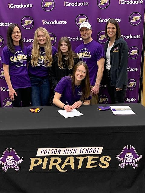 Maggie Todd, seated, signs her letter of intent to play volleyball at Carroll College. Behind her are, from left: mother Jill Todd, sisters Clara and Eliza, father Steve Todd and Polson volleyball coach Lizzy Cox. (Courtesy of Polson High School)